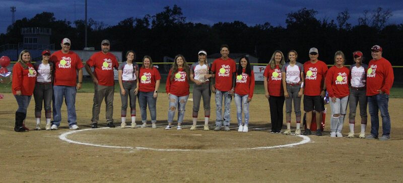 Mexico's five softball seniors, from left, Kylie Burnett, Emma Cunningham, Karlee Sefrit, Brooke Teel and Jordyn Thurman gather with their families on Wednesday during the Senior Night ceremony. The Lady Bulldogs had just defeated Hannibal 5-2.