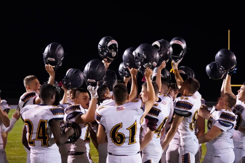 Missouri Military Academy's football team celebrates on Monday after winning its junior varsity game at Russellville.