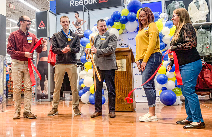 Mexico Walmart Store Manager Brandon Little cut the ribbon at a ceremony celebrating the store&rsquo;s remodeling project on Friday, November 17.