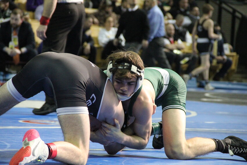 North Callaway senior and three-time state medalist Lane Kimbley grounds his opponent at last season's state wrestling championships.