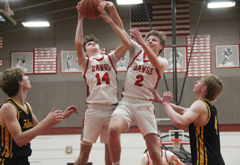 Mexico senior Aidan Knipfel (14) and junior Sam Ryan go for a rebound against Fulton on Tuesday at Gary Filbert Court in Mexico.