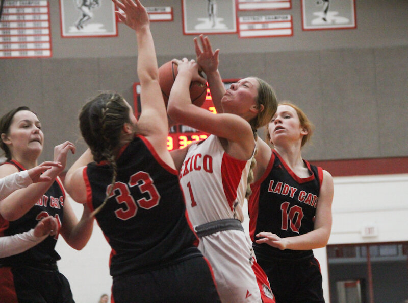Mexico senior Jo Thurman shoots through contact against Bowling Green on Thursday at Gary Filbert Court in Mexico. Thurman finished with 13 points, eight rebounds and seven steals.