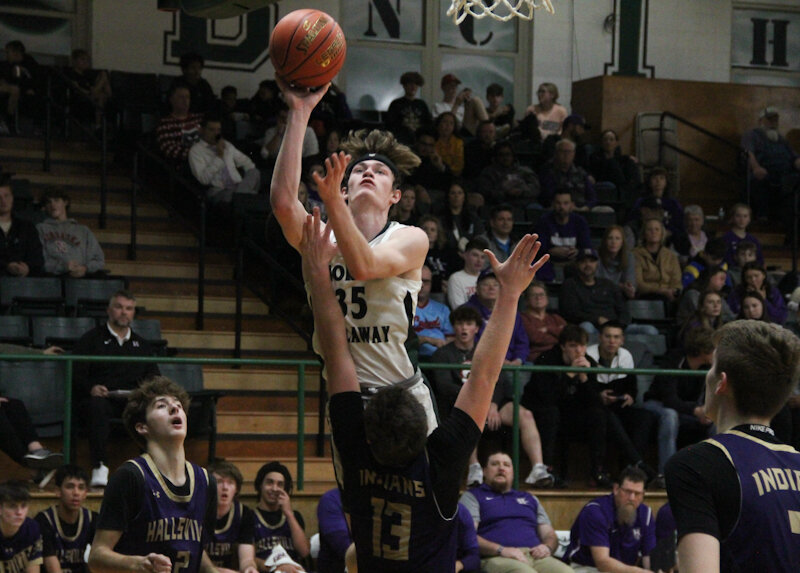 North Callaway senior Isiah Craighead shoots over a Hallsville defender in an earlier home game this season. The Thunderbirds lost to Callaway County rival New Bloomfield late last week at home after a rough fourth quarter.