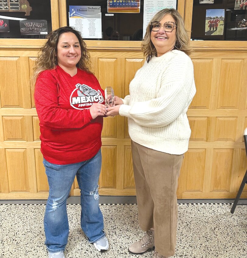 Mexico High School teacher Jennifer Barnett was presented with an award by Keri Cottrell with the Northeast Missouri State Teachers Association.