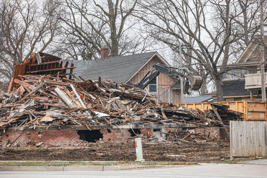City crews worked on demolishing a dilapidated house on Liberty Street last week as part of a program to help clean up the city.