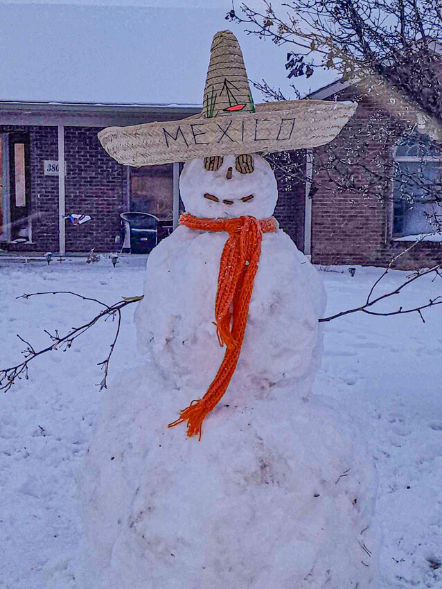 Cody, Jake and Brady Shaw took the opportunity of having a snow day to construct the first snowman of the season.