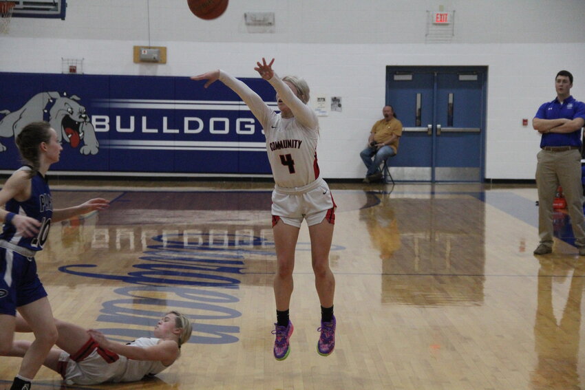 Community sophomore Peyton Beamer shoots a 3-pointer against Paris on Wednesday in the Sturgeon tournament. Beamer hit a key 3-pointer to help the Lady Trojans defeat New Franklin for the third time this season to win third place.