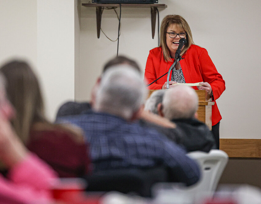 Audrain County Clerk Lisa Smith jokes around with dinner attendees at the annual Audrain County Missouri Farm Bureau annual dinner.