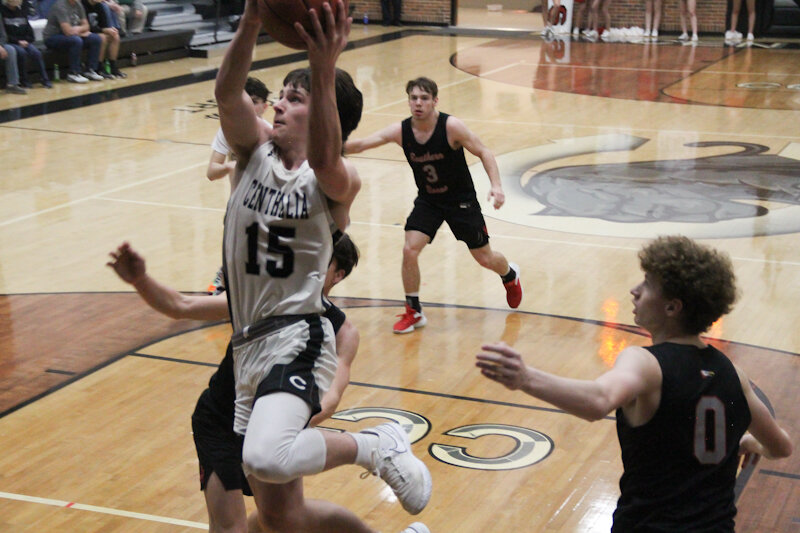 Centralia senior Noah Kropf glides to the rim against Southern Boone on Tuesday during Senior Night in Centralia.
