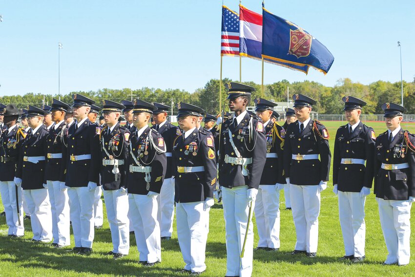 Wearing their full-dress uniforms, Missouri Military Academy cadets stand in formation during a military review on Colonels Field.