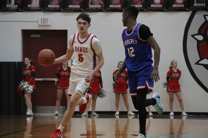 Mexico junior Jaydon Eldridge dribbles down the court on Monday at home against Moberly. Eldridge and the Bulldogs defeated Hannibal on Tuesday night to win their 13th straight game heading into districts next week.