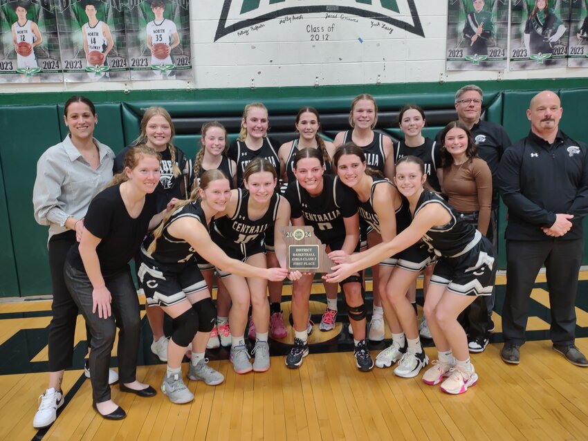 The Centralia girls basketball team poses with its district championship trophy after beating Montgomery County 47-39 in the Class 3 District 7 title game on Feb. 23 at North Callaway High School.