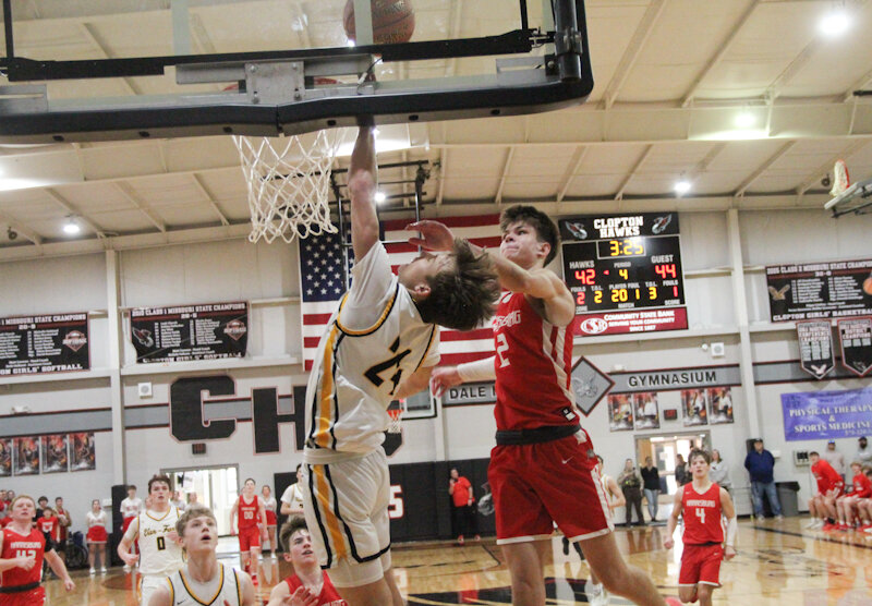 Van-Far senior Nikos Connaway soars to the backboard on a fastbreak layup against Harrisburg during the Class 4 District 8 championship game at Clopton in Clarksville.