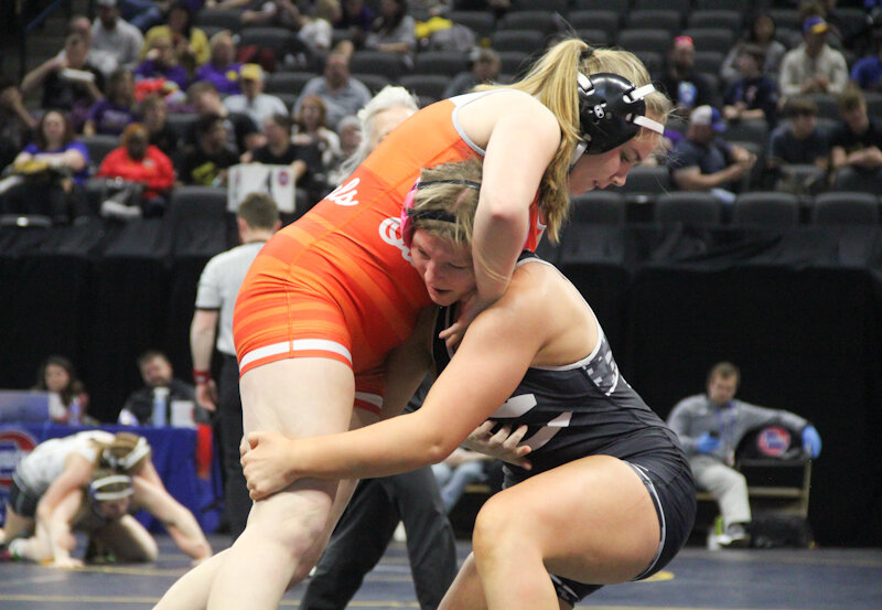 Centralia freshman Jayci Shelton grabs hold of her opponent last week during the Class 1 girls state wrestling meet in Mizzou Arena in Columbia.