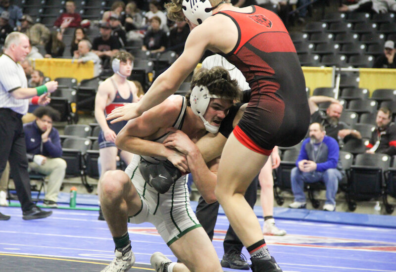 North Callaway senior Lane Kimbley refuses to let loose of his opponent last week during the Class 1 boys state wrestling tournament at Mizzou Arena in Columbia.