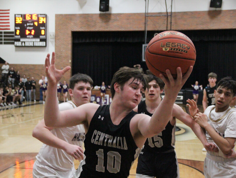 Centralia sophomore Anthony Ford grabs a rebound against Hallsville in the Class 4 District 8 semifinals on Thursday in Centralia. The Panthers play for a district title at 1 p.m. today against Mexico in Centralia.