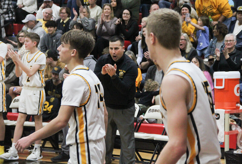 Van-Far head coach Pat Connaway celebrates after the his son Nikos scored on a 3-point play this season. The Connaways were selected as district coach and player of the year.