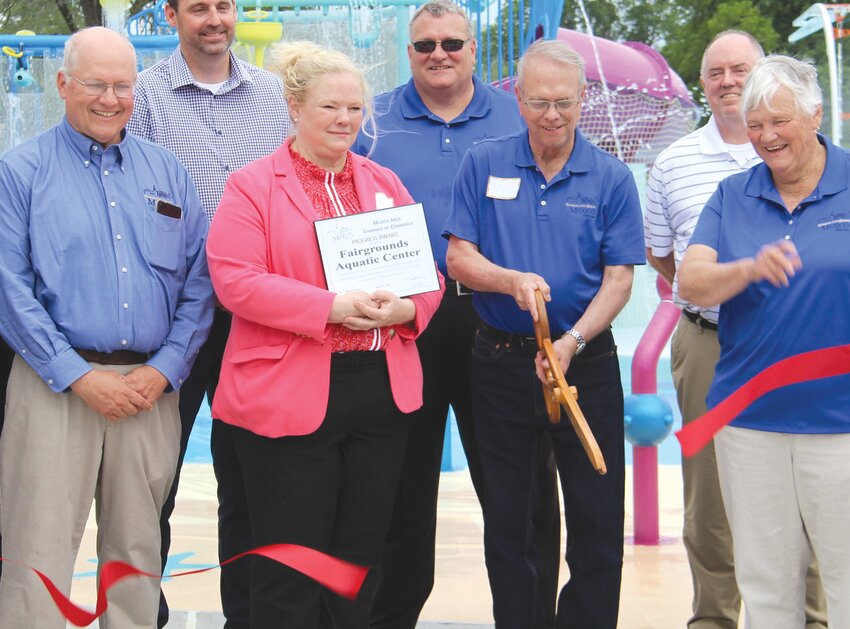 Chad Shoemaker, far left, is shown in attendance at the ribbon cutting for Fairgrounds Aquatic Center in 2021, one of many accomplishments during his tenure.