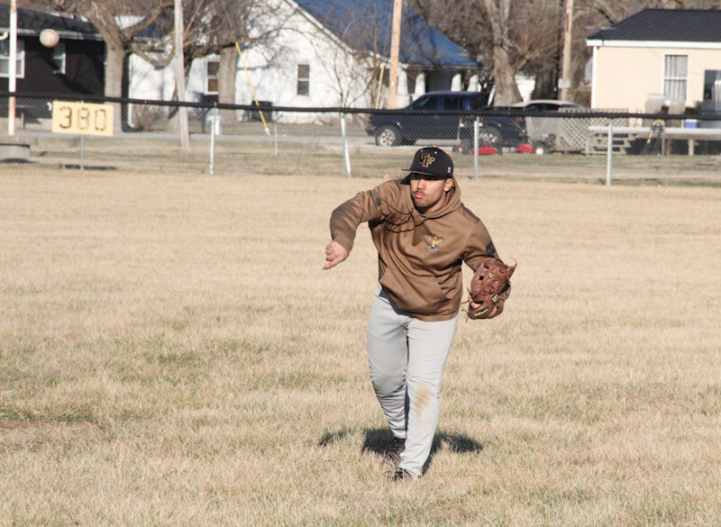 Van-Far junior Tyson Douglas plays catch during a preseason practice.