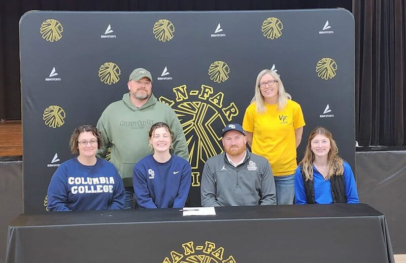 Van-Far senior McKenna Engh-Hoffman gathers with her family and coaches on March 5 during her college signing ceremony at Van-Far High School in Vandalia. Engh-Hoffman will compete in track and field at Columbia College.