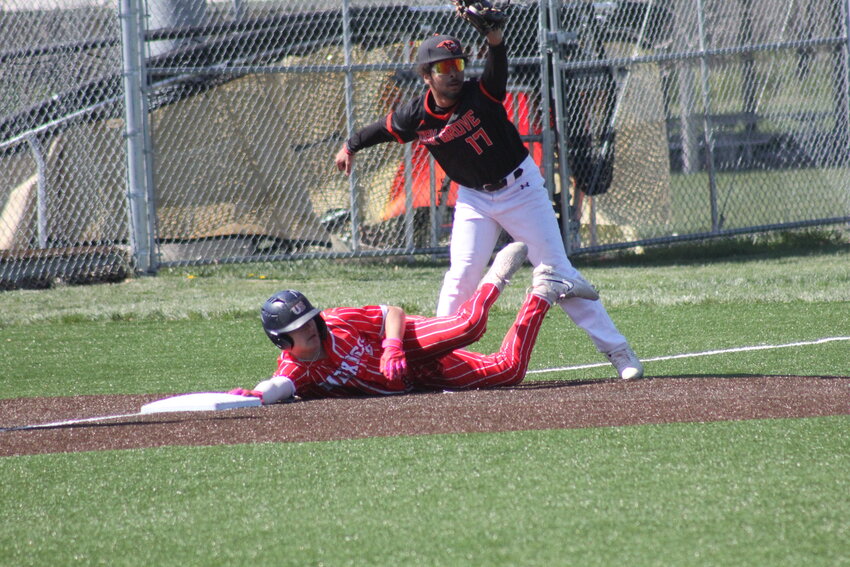 Mexico sophomore Drew DeMint attempts to take third base after hitting a two-RBI double against Oak Grove on Saturday in Mexico. The Bulldogs won 10-4, and DeMint had three RBI.