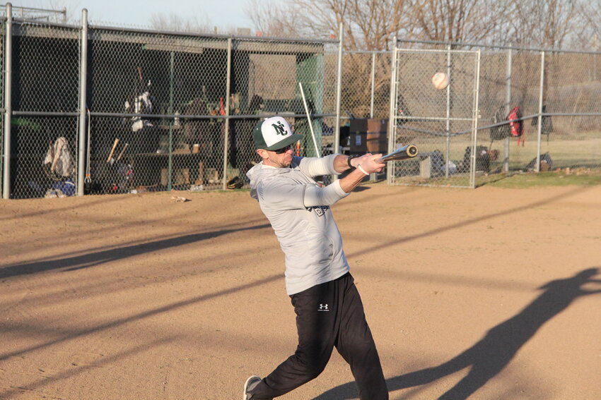 North Callaway head coach Kirt Kleindienst hits a ball during practice drills before this season. The first-year head coach Kleindienst is leading a hot North Callaway offense right now.