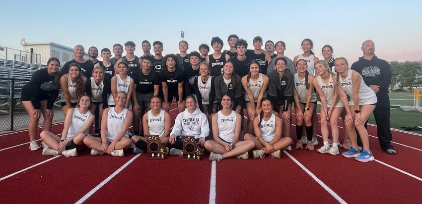 The Centralia girls and boys track and field teams gather around their Clarence Cannon Conference trophies that they won in Monday's conference meet in Monroe City.