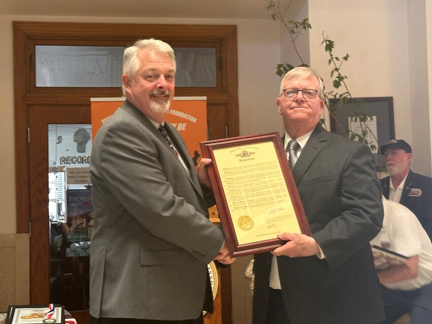 Representative Kent Haden presents a House Resolution to Audrain County Presiding Commissioner Alan Winders.  He also read a proclamation from Lt Governor Mike Kehoe.