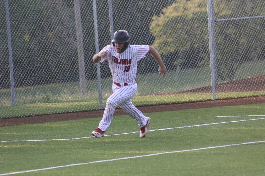 Community R-6 senior Aaron Carter rounds third base against Class 1 No. 6 Higbee on Monday in Mexico. The Trojans scored seven runs in the fourth inning and beat Higbee 9-0 on Senior Night.