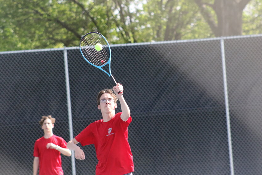 Mexico senior Trevor Wright returns a ball in an earlier match this season. Wright had a key third-set-tiebreaker win on Tuesday to defeat St. Charles West 5-4 in team districts.