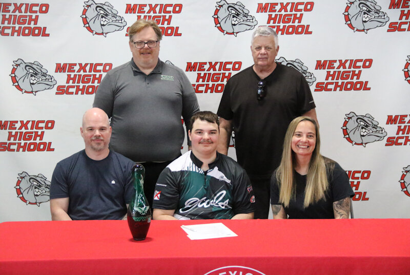 Mexico senior Chayse Samuelson is surrounded by his family and William Woods University bowling head coach Bill Holbrook on Friday in Mexico during his signing ceremony to compete for William Woods bowling.