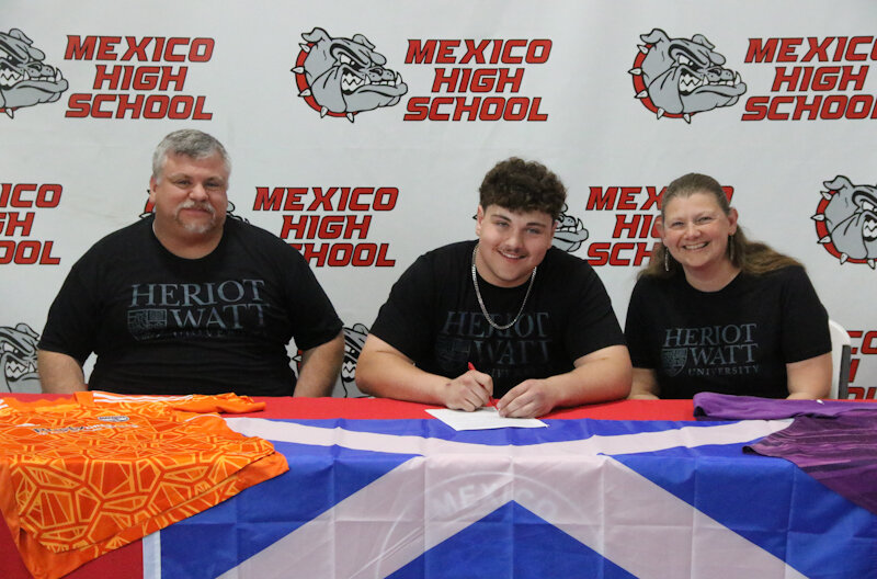 Mexico senior Emille Scanavino signs his letter of intent on May 6 in Mexico to play soccer for Heriot-Watt University in Scotland. The goalkeeper Scanavino was there with his parents as he committed to playing overseas.