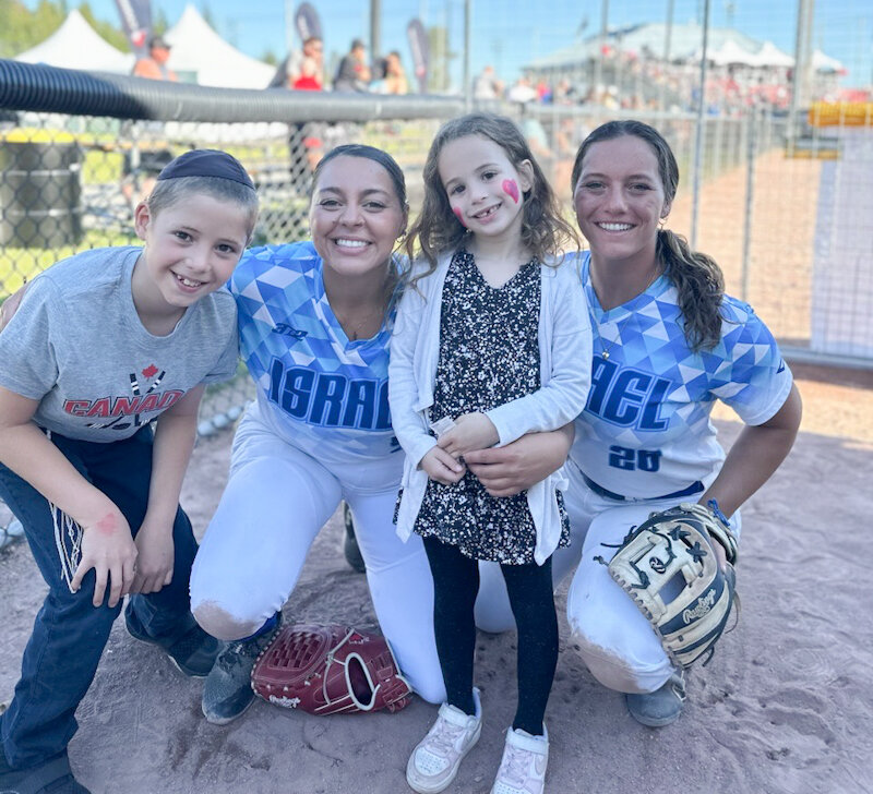 Mexico graduate Paytience Holman (second from left) poses with young Team Israel fans during the Canada Cup International Softball Championship in the first week of July in Surrey, British Columbia, Canada. It was the final action after Holman finished her career at Southeast Missouri State University.