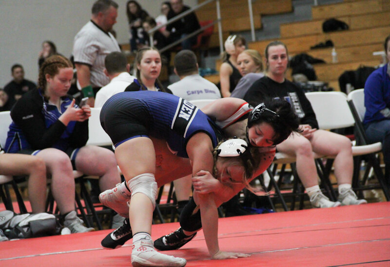 Kaylynn Pehle wraps up an opponent during a meet in 2022. Pehle was one of the first wrestlers in the Mexico girls program when it started a few years ago and will become an assistant coach this season.