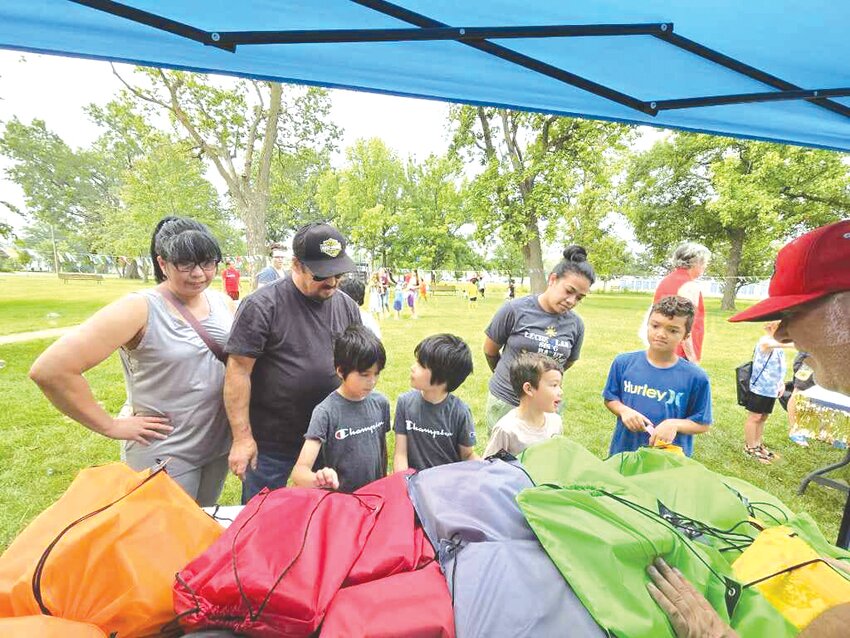 The supply giveaway table was a popular stop at Living Hope’s Back to School Fun Day held Saturday.