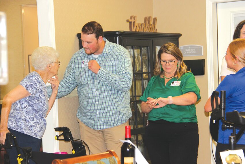 Connor Salisbury introduces himself to residents and their families.