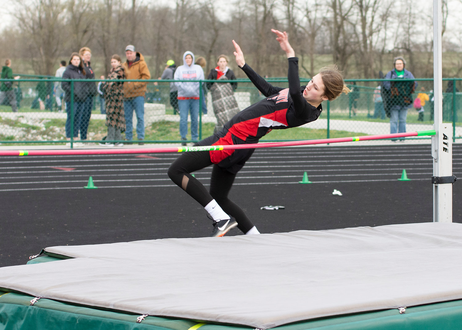 Paige Meyer clears the bar in the high jump competition at North Callaway. Meyer broke Community R-6's school record with a 4-9. [Leslie A. Meyer Photography]