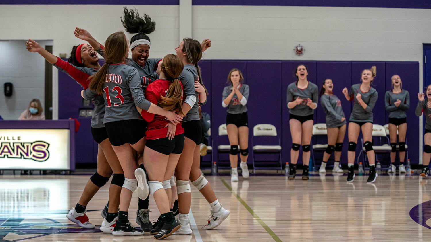 The Bulldogs celebrate a win in the first round of district play against Centralia in Hallsville last week. Addison McCoy, Jessica Stephens and Nayeli Ruiz were named to conference, district teams. (Eric Mattson)