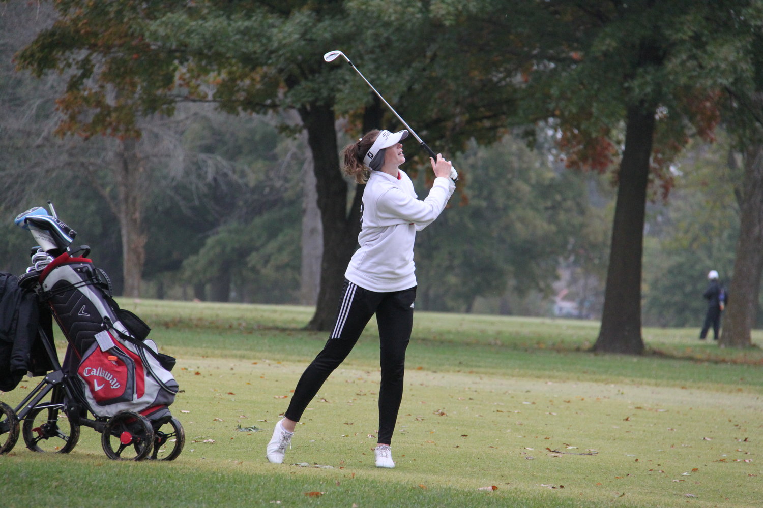 Lilly Knipfel keeps an eye on an approach shot lofted toward a green on the back nine during Tuesday’s final round of the class 2 state golf tournament.