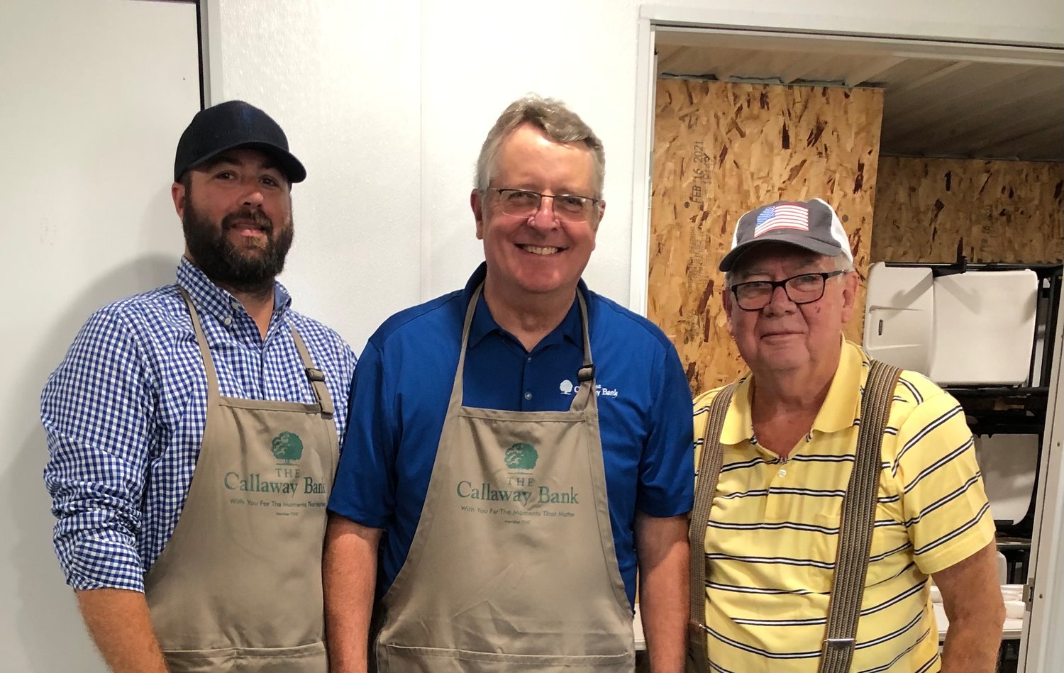 The Callaway Bank team served Tuesday of Loafer's Week in Auxvasse. Among employees taking part, from left, were Cody Whalen and Garry Melton. They are joined by Donald Knipp, Auxvasse Lions Club. [Submitted Photo]