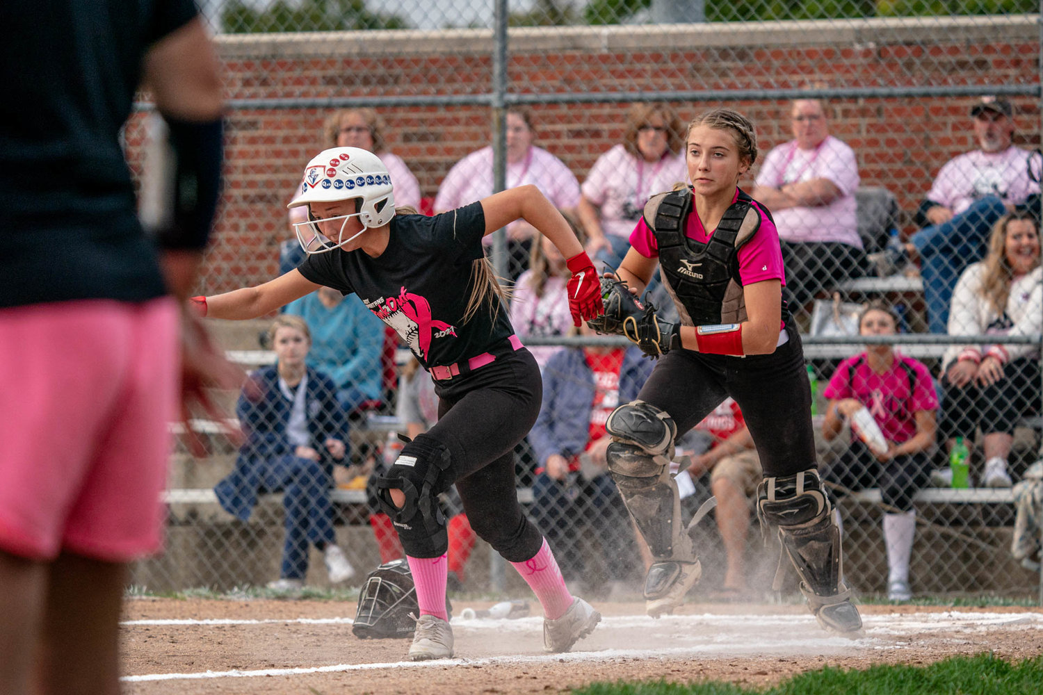 Bulldogs catcher Karlee Sefrit chases down a Moberly runner. [Eric Mattson]
