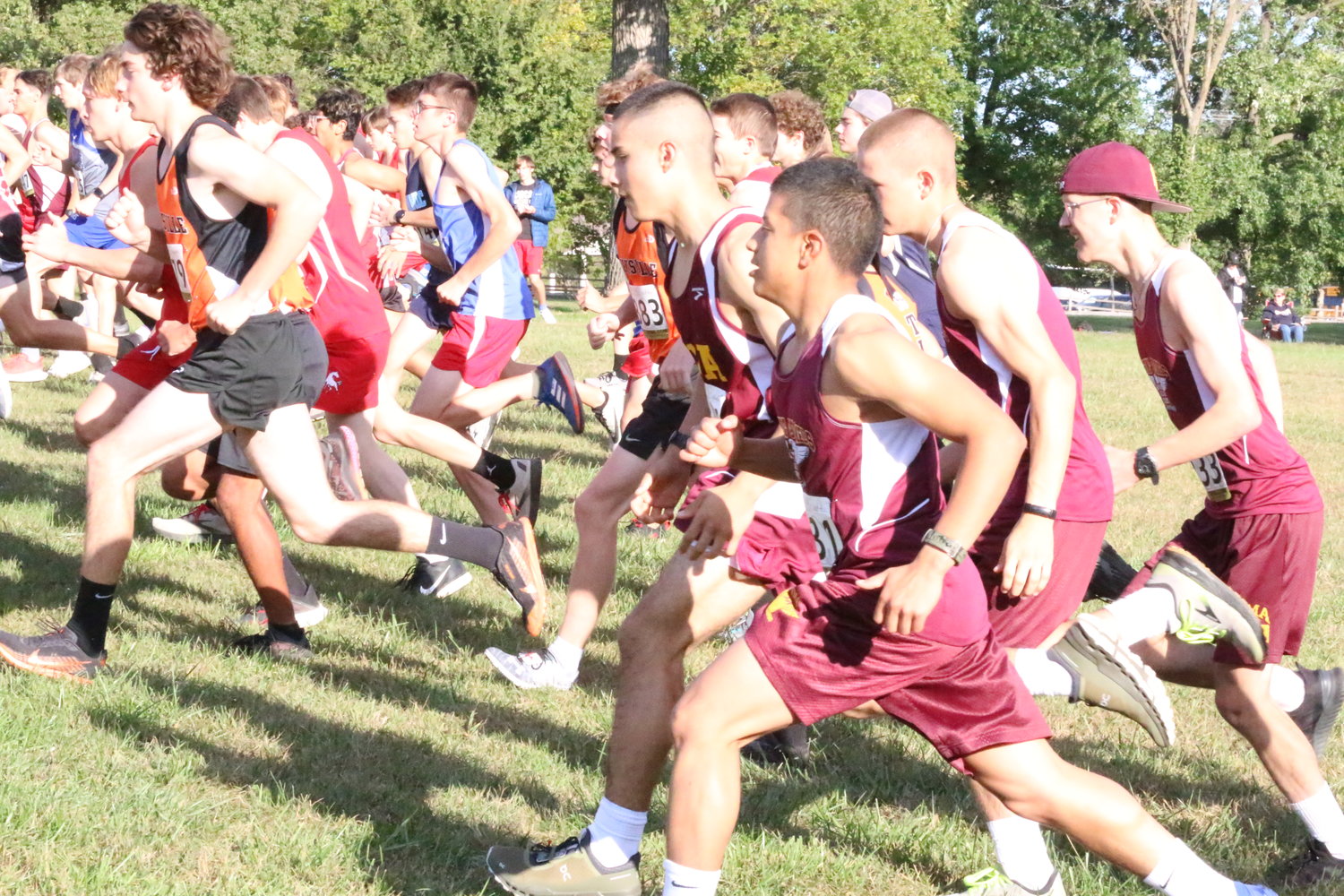 MMA cross country runners take off with the opening gun Tuesday. [Nathan Lilley]