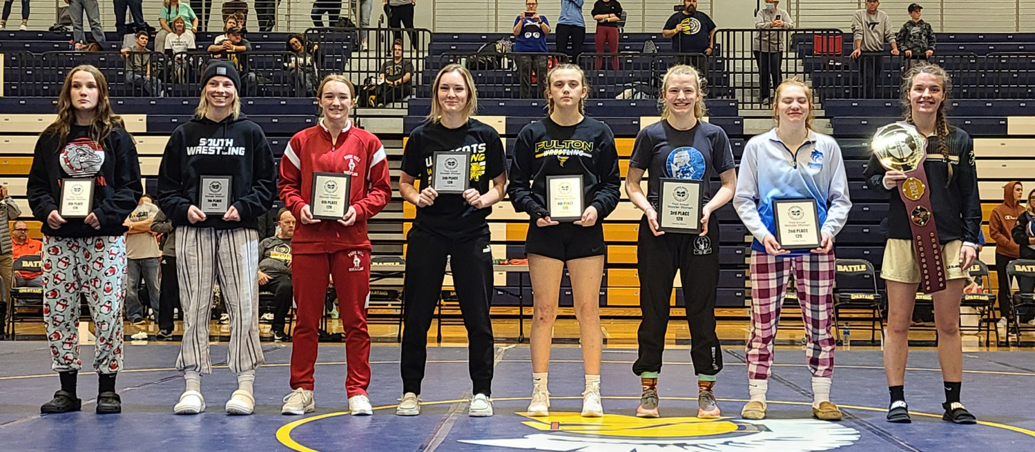 Abby Drew stands with the top finishers of the 120-pound class of the Wonder Woman Wrestling Tournament. The Mexico sophomore placed eighth. [Photo courtesy of Tony Senor]