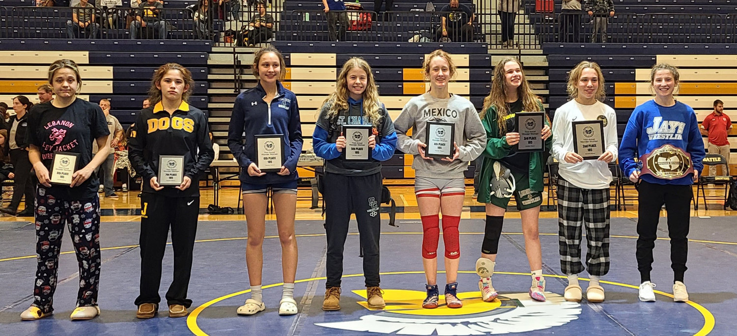 Katie Bowen stands with the top finishers of the 105-pound class of the Wonder Woman Wrestling Tournament. The Mexico sophomore placed fourth. [Photo courtesy of Tony Senor]