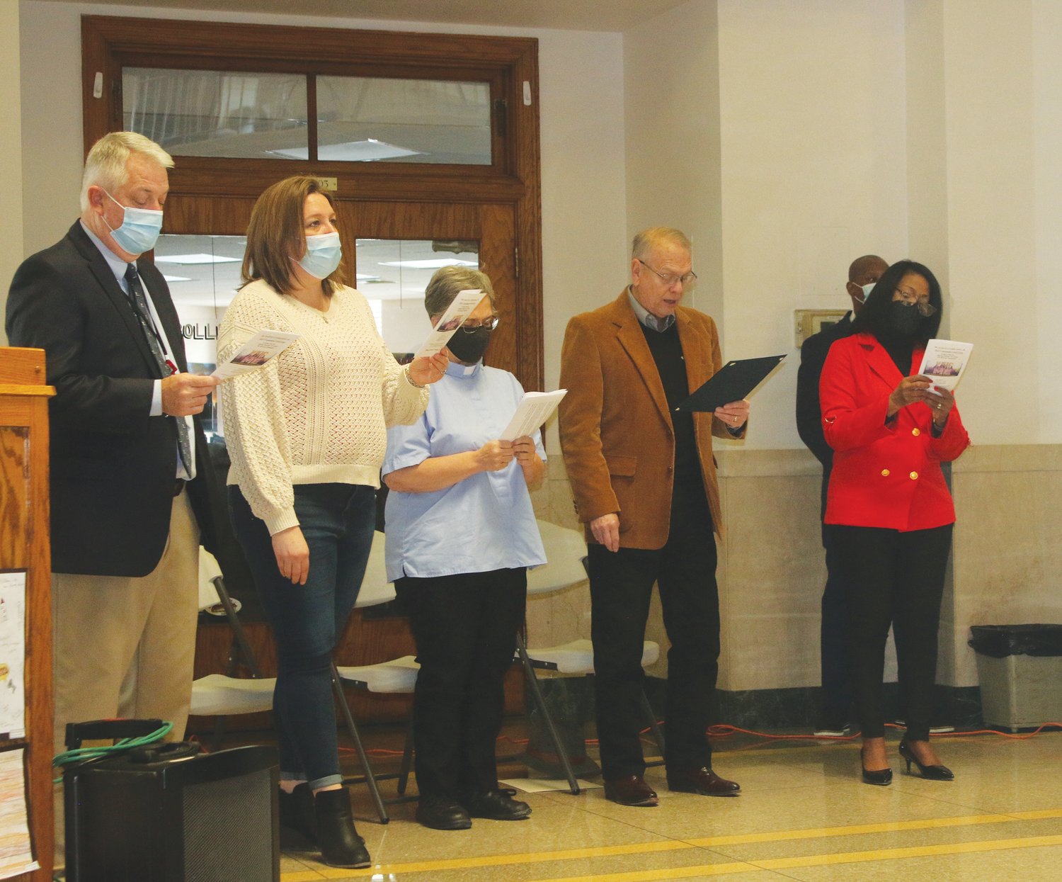 Commissioner Alan Winders, Chamber President Melanie Utterback, First Presbyterian Church Rev. Dr. Susan Presley, Mexico Mayor Chris Miller and MLK Celebration organizer Jaye Jackson participated in the singing of "Lift Ev'ry Voice and Sing," played by organist Minister Rachel Owens.