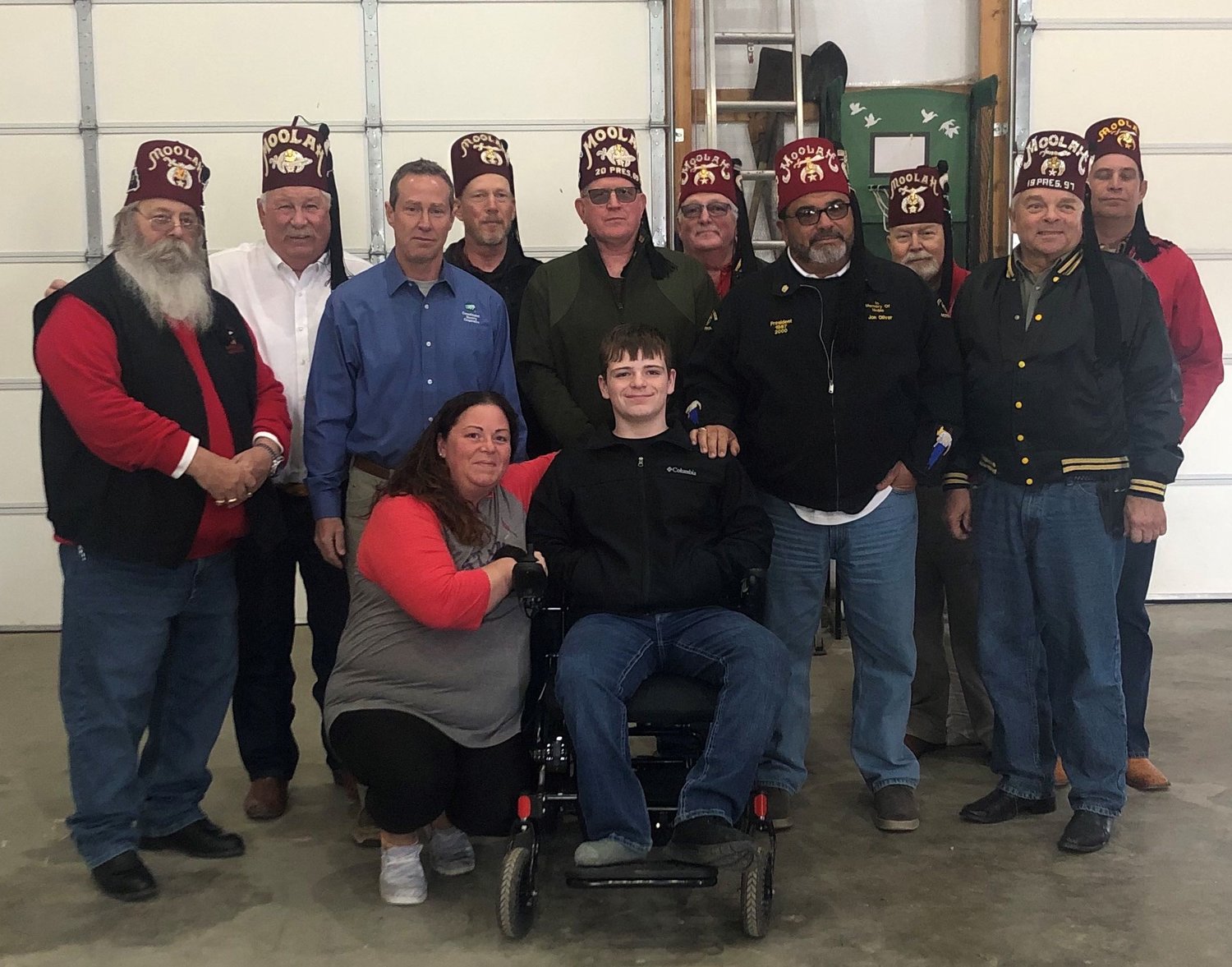 Standing Left to Right.  Noble Steve Sales, Noble Rennie Davis. Consolidated Electric Manager Lynn Thompson. Noble Brad Hagan, Noble Larry Brandow, Noble Robbie Hodges, Noble Brian Purciful, Noble Mike Brandenbueg, Noble John Lowrey and Noble J.C. Davis.  Kneeling is his mother Jamey Creed and Bryson Regot in his wheelchair.