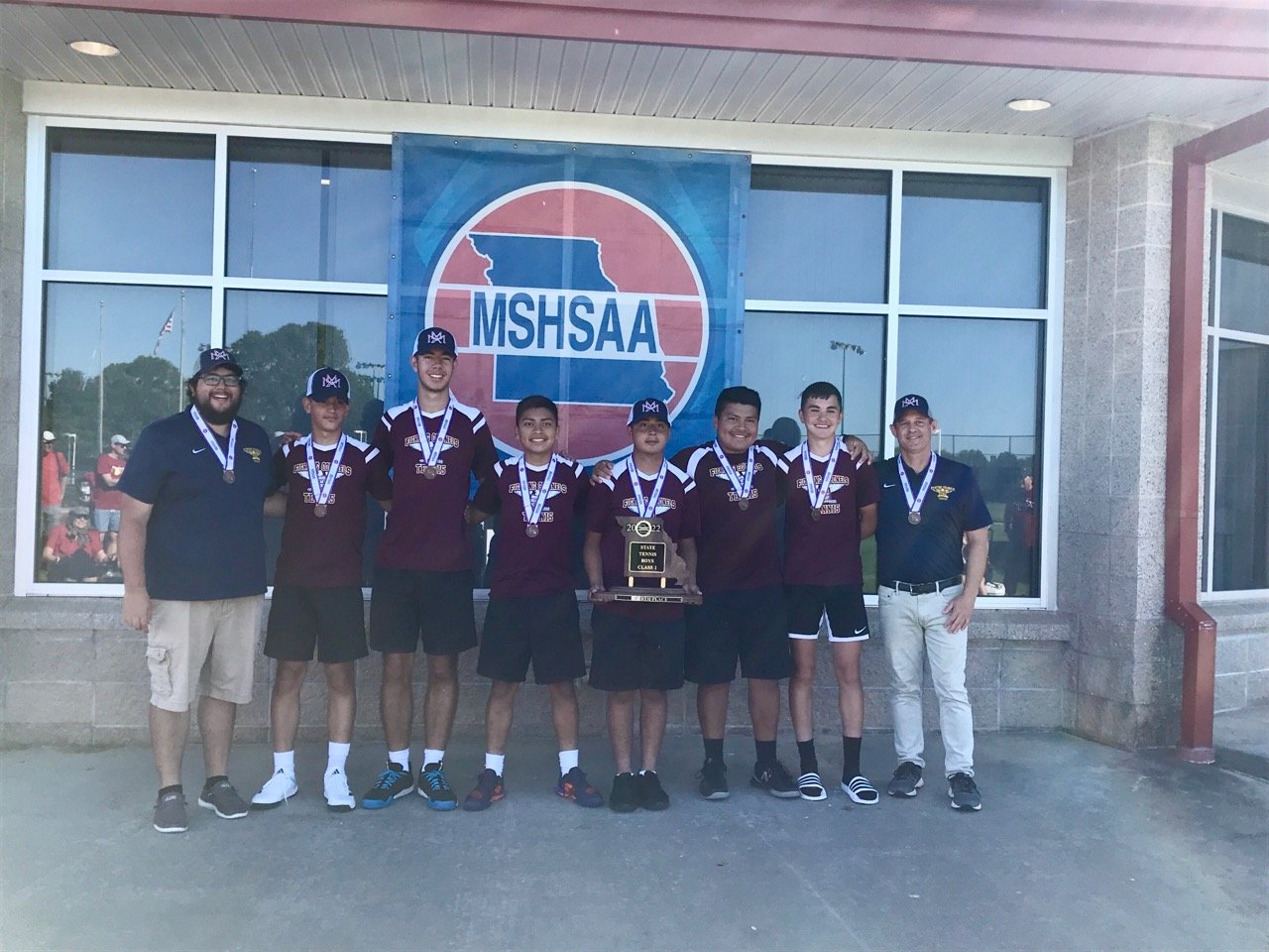 The Missouri Military Academy tennis team poses with its fourth-place state plaque (its first Final Four since 1992) on May 27 at the Class 1 state tournament in Springfield. Pictured, from left, are head coach Brad Smith, Gorka Yarte-Zertuche, Luis Orozco-Navarro, Samuel Way, Jose Anguiano, Simon Way, Nathan Dempsey and assistant coach Tom Allen.