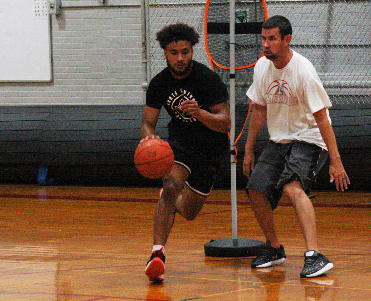 Mexico's Isaiah Reams works out with boys basketball head coach Darren Pappas in July at Mexico High School. Reams will begin his college career this fall at NJCAA North Central Missouri College in Trenton.