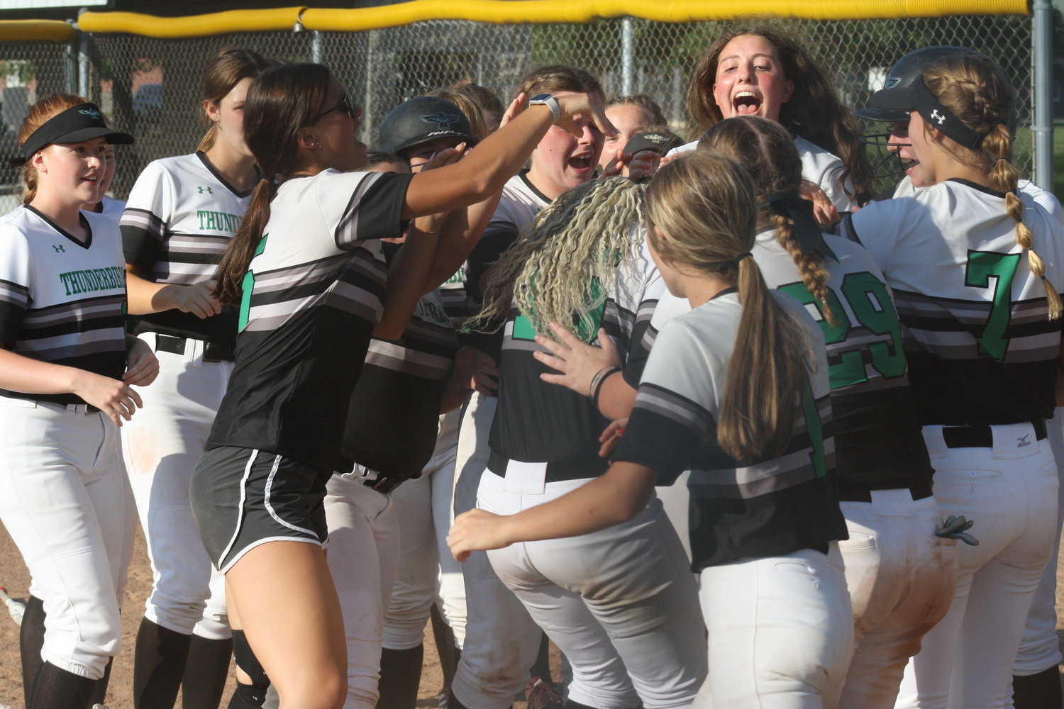 North Callaway freshman Kymorie Myers surrounded by teammates after home run