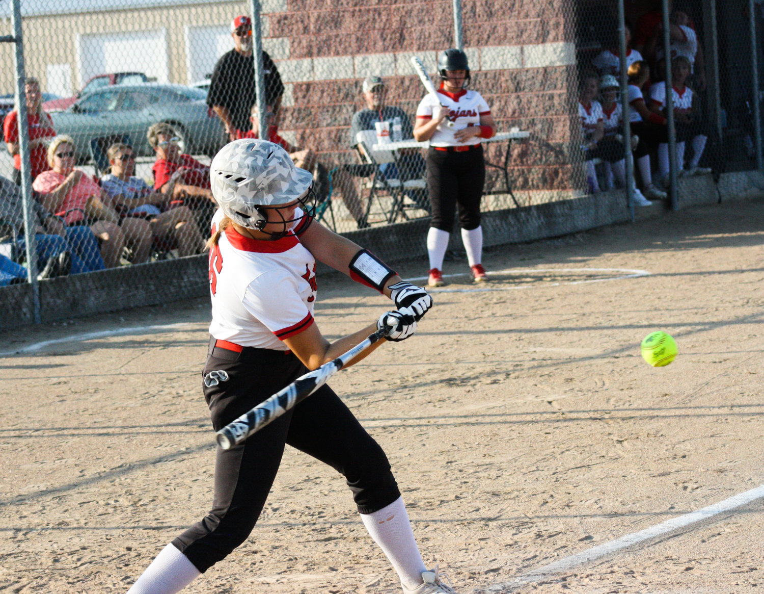 Community R-6 freshman first baseman Jocelyn Curtis takes a swing at a Sept. 14 home game against Paris. Curtis had two crucial RBI hits that helped the Lady Trojans come back Thursday to defeat district foe Van-Far in Laddonia.